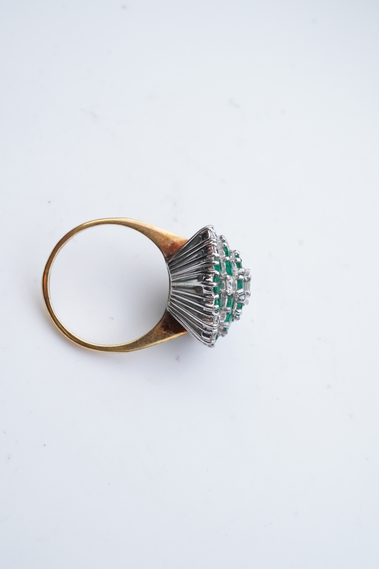 An emerald and diamond cocktail ring